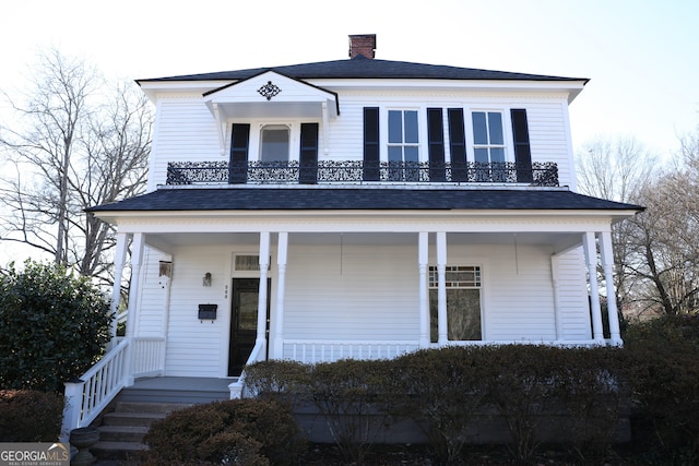 view of front of property with a balcony