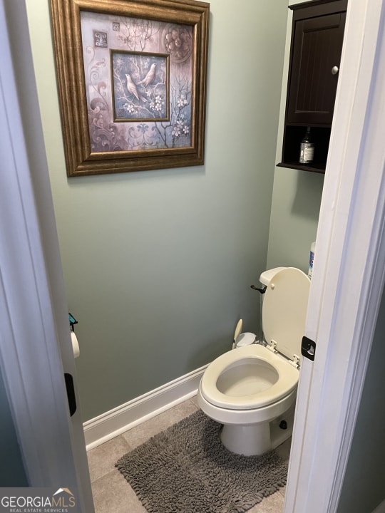 bathroom with tile patterned floors and toilet