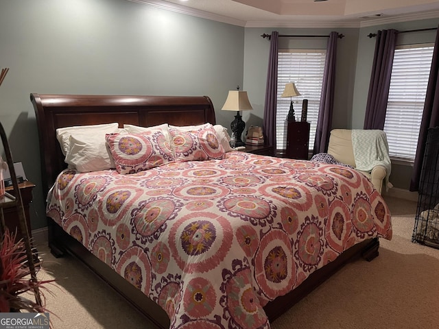 bedroom with crown molding, light colored carpet, and multiple windows