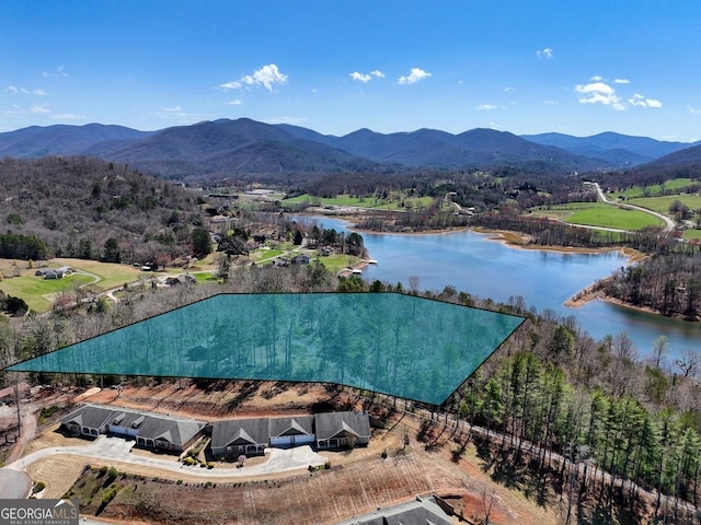 bird's eye view with a water and mountain view