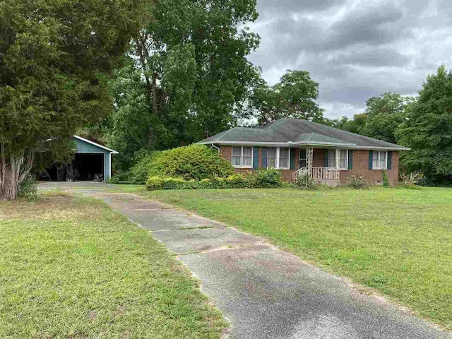 ranch-style home with a front lawn