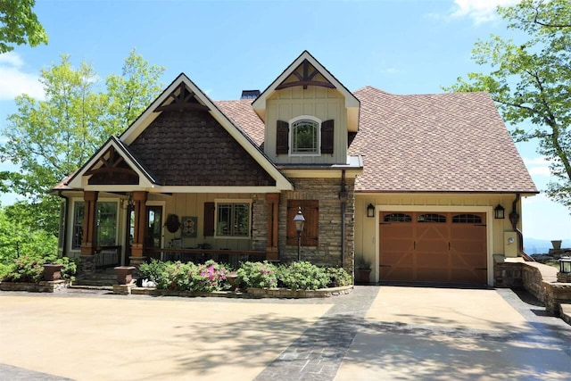 craftsman-style home with a porch and a garage