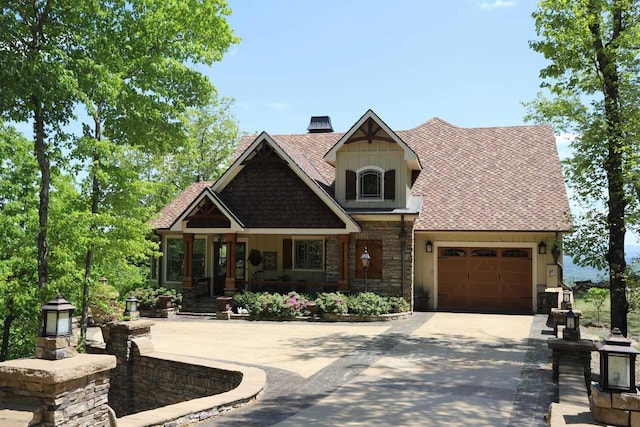 craftsman-style home featuring a porch and a garage