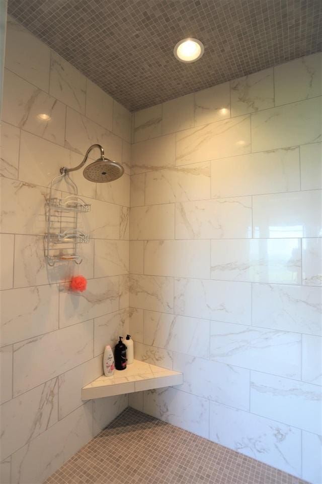 bathroom with tiled shower