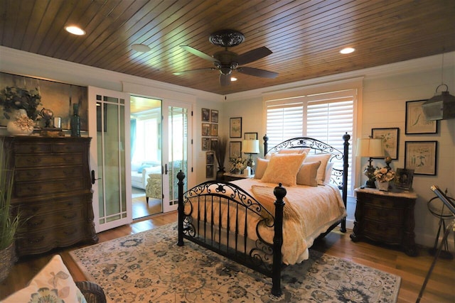 bedroom with wooden ceiling, hardwood / wood-style flooring, ceiling fan, and access to exterior