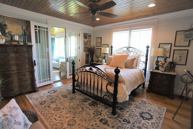 bedroom featuring wooden ceiling, ornamental molding, hardwood / wood-style floors, and ceiling fan