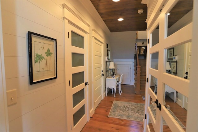 hall featuring wood ceiling and dark hardwood / wood-style flooring