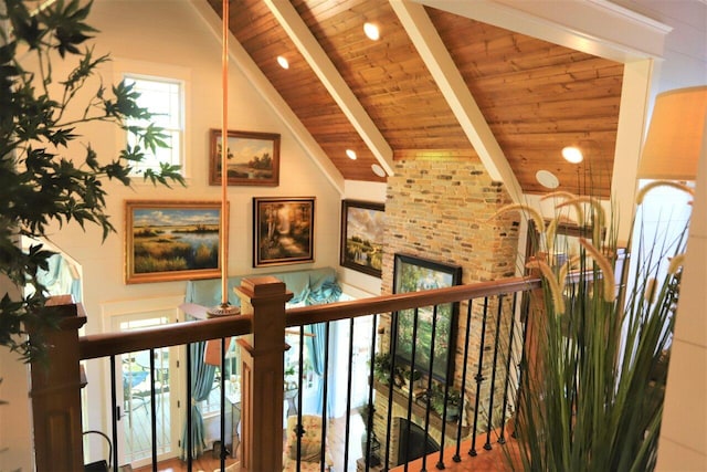 hallway featuring beam ceiling, high vaulted ceiling, and wooden ceiling