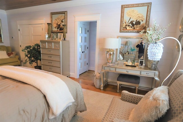 bedroom featuring light wood-type flooring and a closet