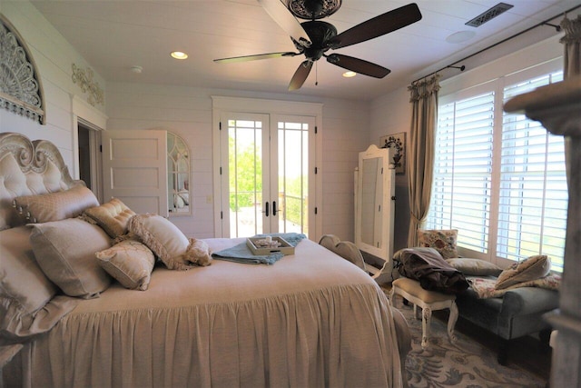 bedroom with french doors, ceiling fan, and access to outside