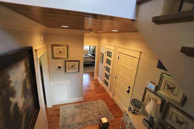 corridor with wooden ceiling and hardwood / wood-style floors