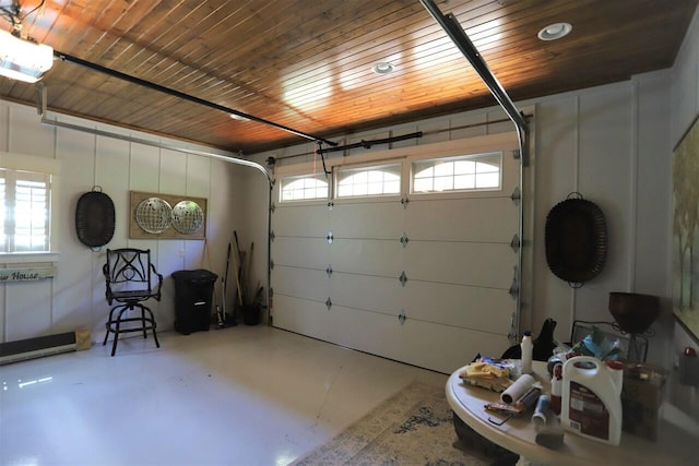 garage with wood ceiling and a garage door opener