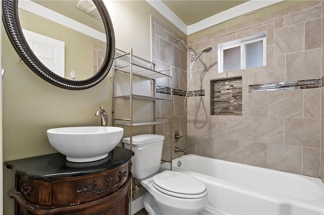 full bathroom featuring vanity, toilet, and tiled shower / bath