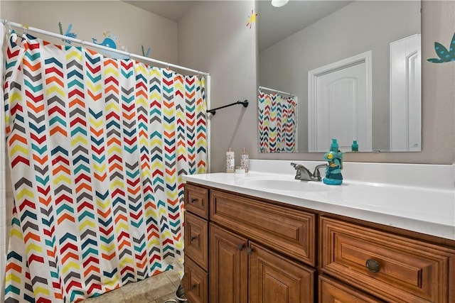 1205 Carolina St, College Station, TX 77840 - bathroom featuring tile patterned flooring and vanity