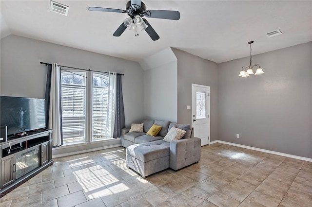 1205 Carolina St, College Station, TX 77840 - living room with visible vents, vaulted ceiling, baseboards, and ceiling fan with notable chandelier