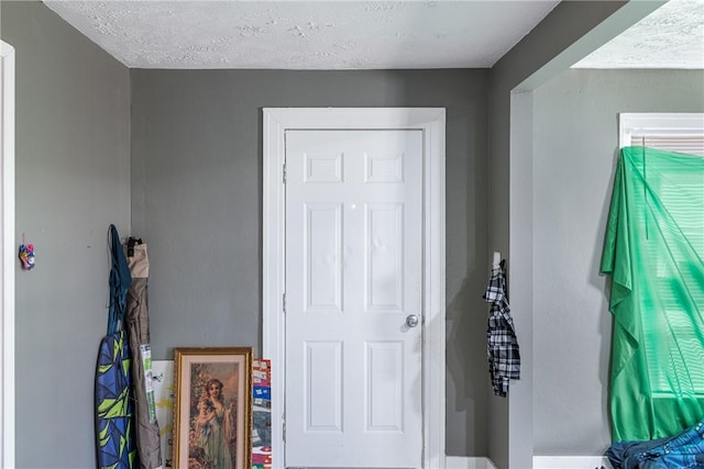 interior space with a textured ceiling