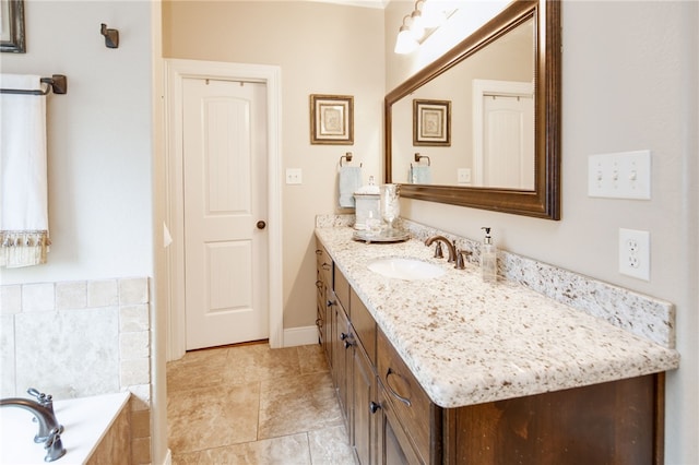 bathroom featuring vanity and tiled bath