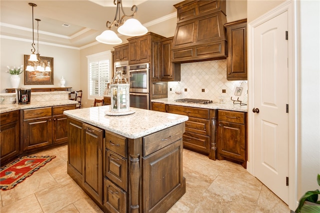 kitchen featuring appliances with stainless steel finishes, premium range hood, ornamental molding, pendant lighting, and a center island