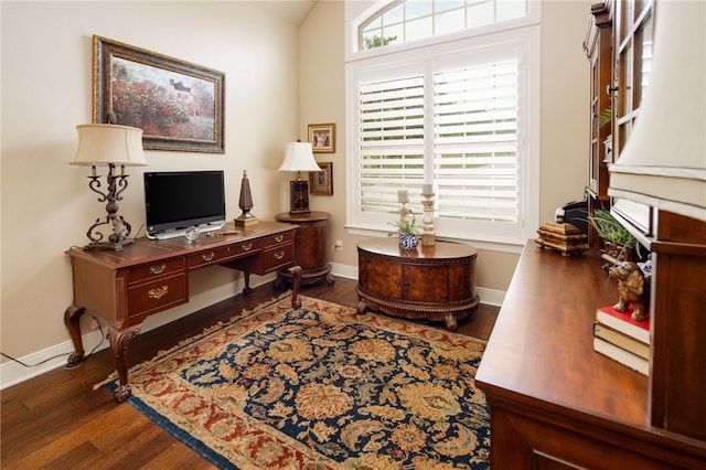 office area featuring dark hardwood / wood-style flooring and lofted ceiling