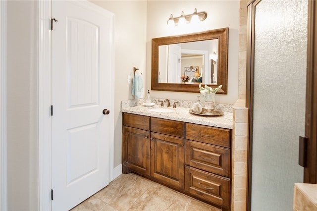 bathroom featuring vanity and an enclosed shower