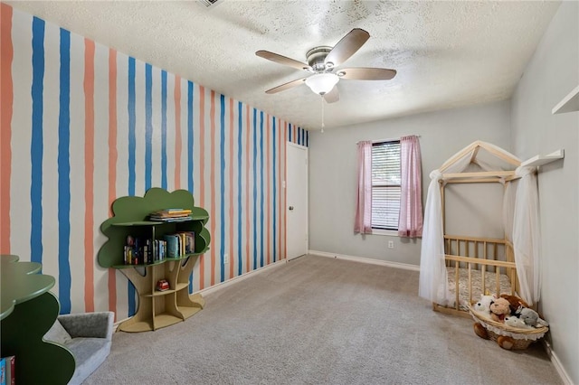 misc room with light carpet, a textured ceiling, and ceiling fan