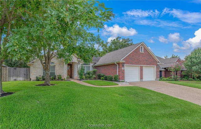 view of front of property with a front lawn and a garage