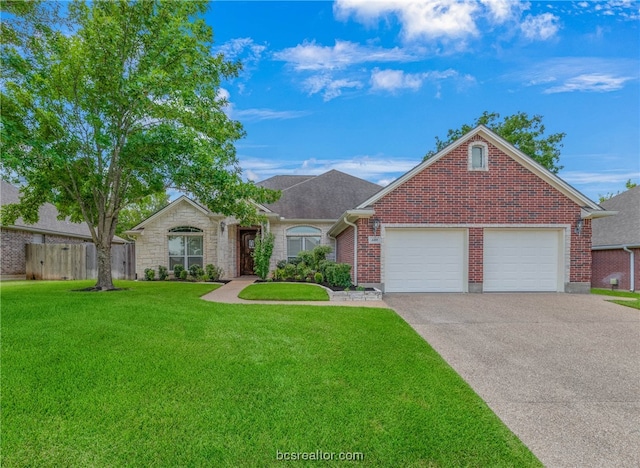 view of front of house with a garage and a front lawn