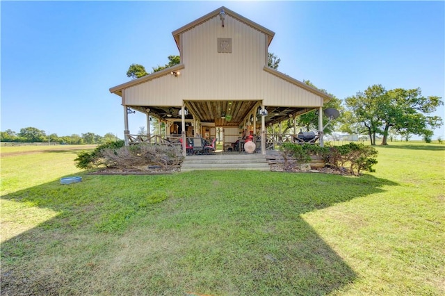 back of house with a lawn