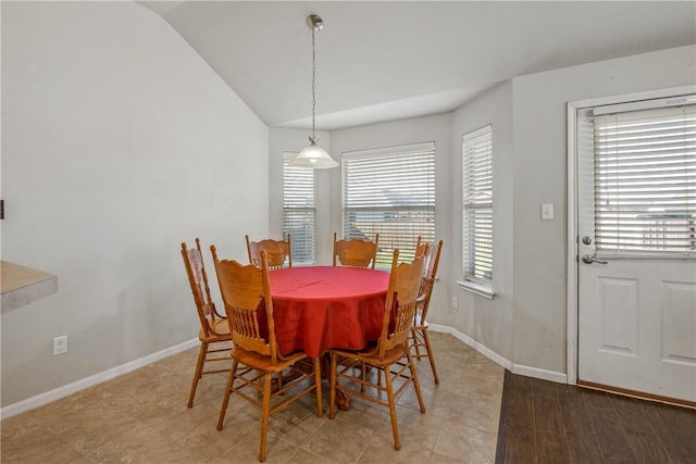 dining room with vaulted ceiling