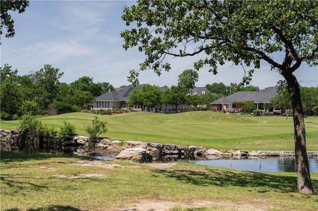1107 Royal Adelade Dr, College Station, TX 77845 - view of property's community with golf course view, a lawn, and a water view