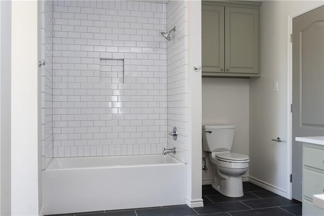 1107 Royal Adelade Dr, College Station, TX 77845 - bathroom featuring toilet, tile patterned flooring, baseboards, and tub / shower combination