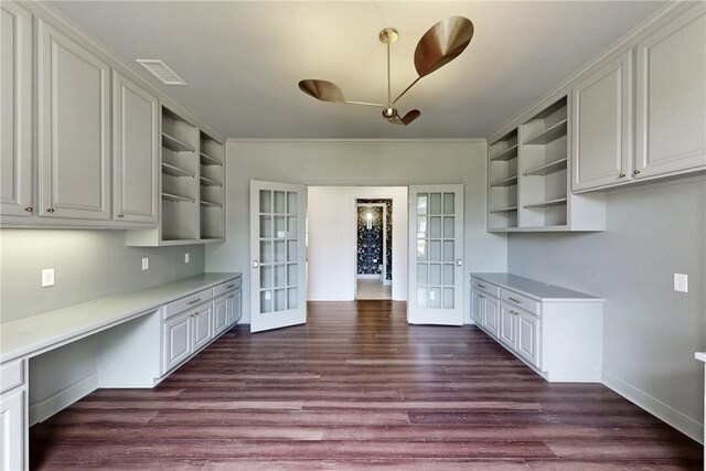 1107 Royal Adelade Dr, College Station, TX 77845 - kitchen with appliances with stainless steel finishes, dark wood-style floors, light countertops, a breakfast bar area, and a textured ceiling