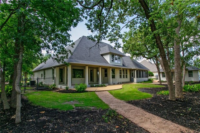 1107 Royal Adelade Dr, College Station, TX 77845 - view of front of property featuring brick siding, a sunroom, and a shingled roof