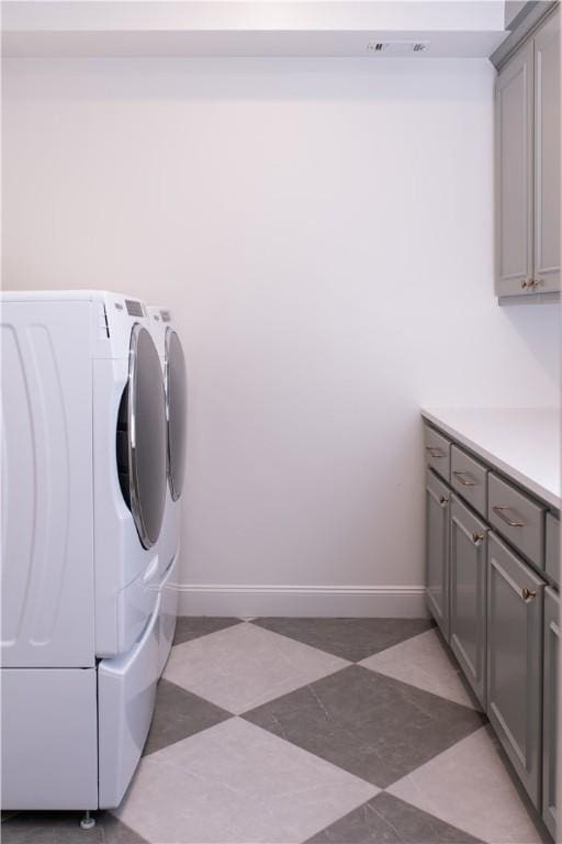 1107 Royal Adelade Dr, College Station, TX 77845 - laundry area featuring baseboards, washing machine and clothes dryer, and cabinet space