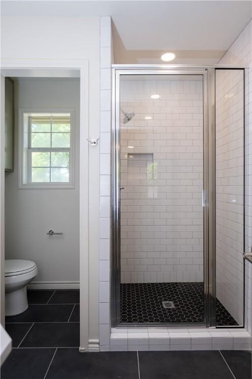 1107 Royal Adelade Dr, College Station, TX 77845 - full bathroom featuring toilet, a shower stall, and tile patterned flooring