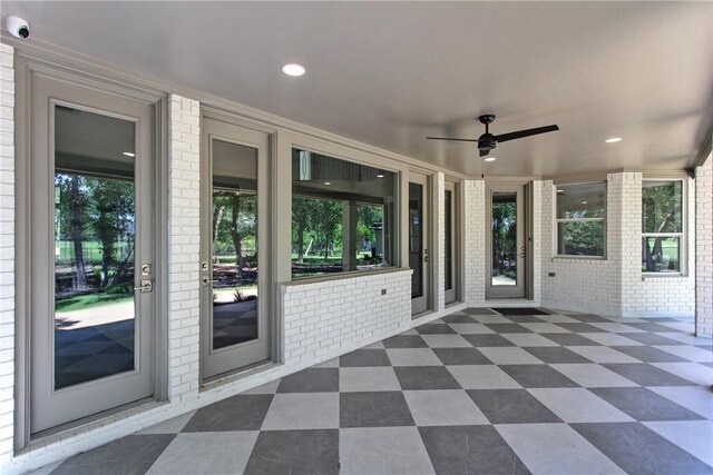 1107 Royal Adelade Dr, College Station, TX 77845 - view of exterior entry featuring brick siding, a porch, and a shingled roof