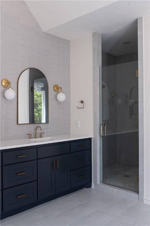 1107 Royal Adelade Dr, College Station, TX 77845 - bathroom with tile patterned floors, vanity, and a stall shower