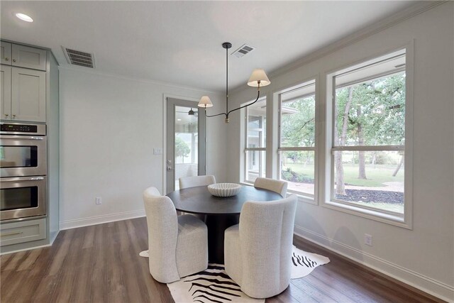 1107 Royal Adelade Dr, College Station, TX 77845 - dining area featuring dark wood-type flooring and crown molding