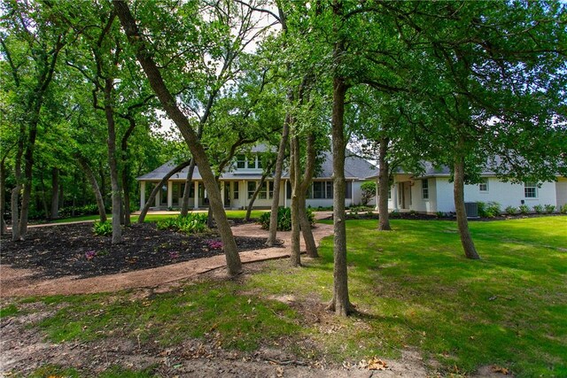 1107 Royal Adelade Dr, College Station, TX 77845 - property entrance with brick siding, a shingled roof, and ceiling fan