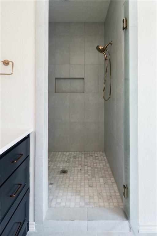 1107 Royal Adelade Dr, College Station, TX 77845 - bathroom with a shower stall and vanity