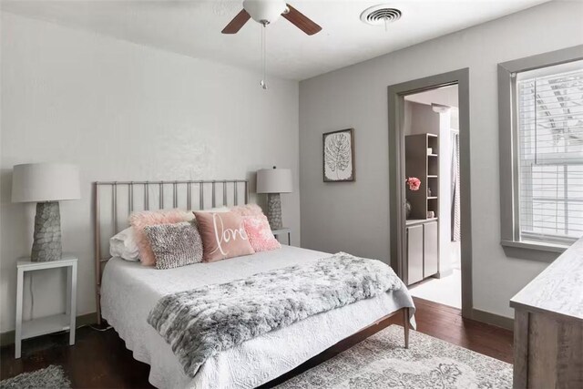 1017 Milner Dr, College Station, TX 77840 - bedroom featuring dark wood-style floors, baseboards, and a ceiling fan