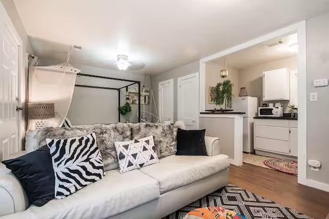 1017 Milner Dr, College Station, TX 77840 - living room with dark wood-style floors