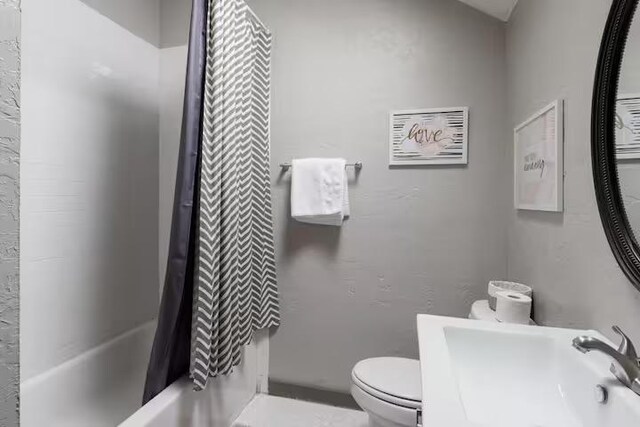1017 Milner Dr, College Station, TX 77840 - bathroom with toilet, shower / bath combo, and a sink