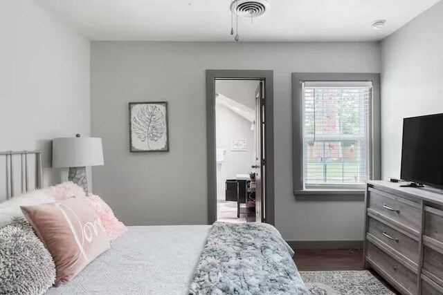 1017 Milner Dr, College Station, TX 77840 - bedroom with multiple windows, baseboards, and wood finished floors
