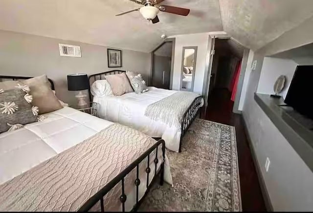1017 Milner Dr, College Station, TX 77840 - bedroom with vaulted ceiling and a ceiling fan