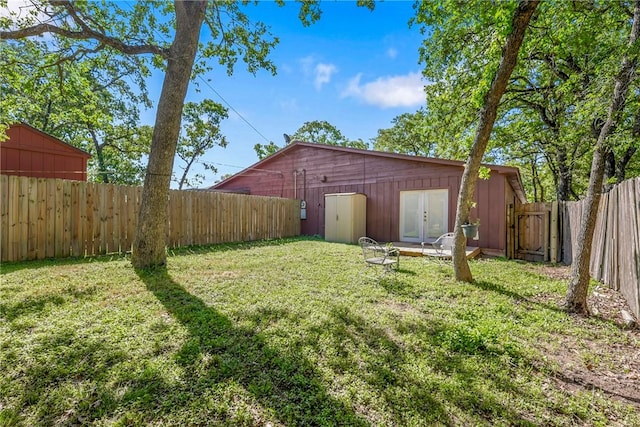 2212 Young Pl Unit A, Bryan, TX 77807 - view of yard featuring french doors and a fenced backyard