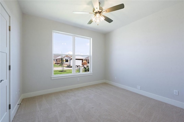 carpeted empty room with ceiling fan