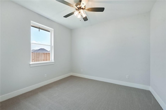 carpeted empty room featuring ceiling fan