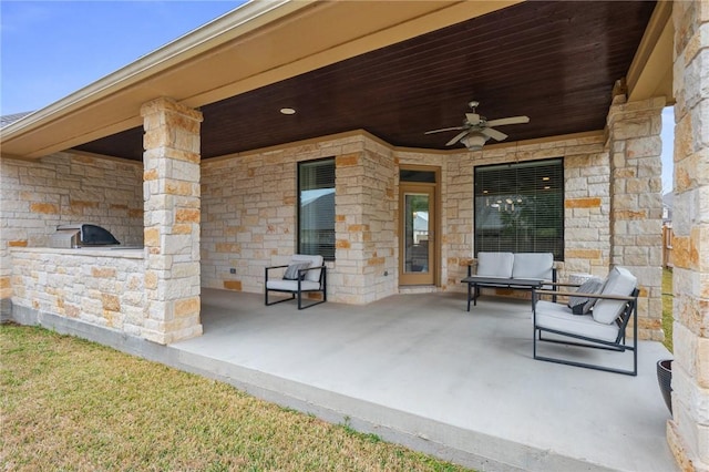 view of patio / terrace featuring area for grilling and a ceiling fan