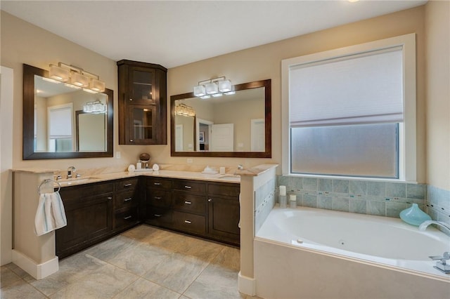 bathroom featuring double vanity, a bath, and a sink